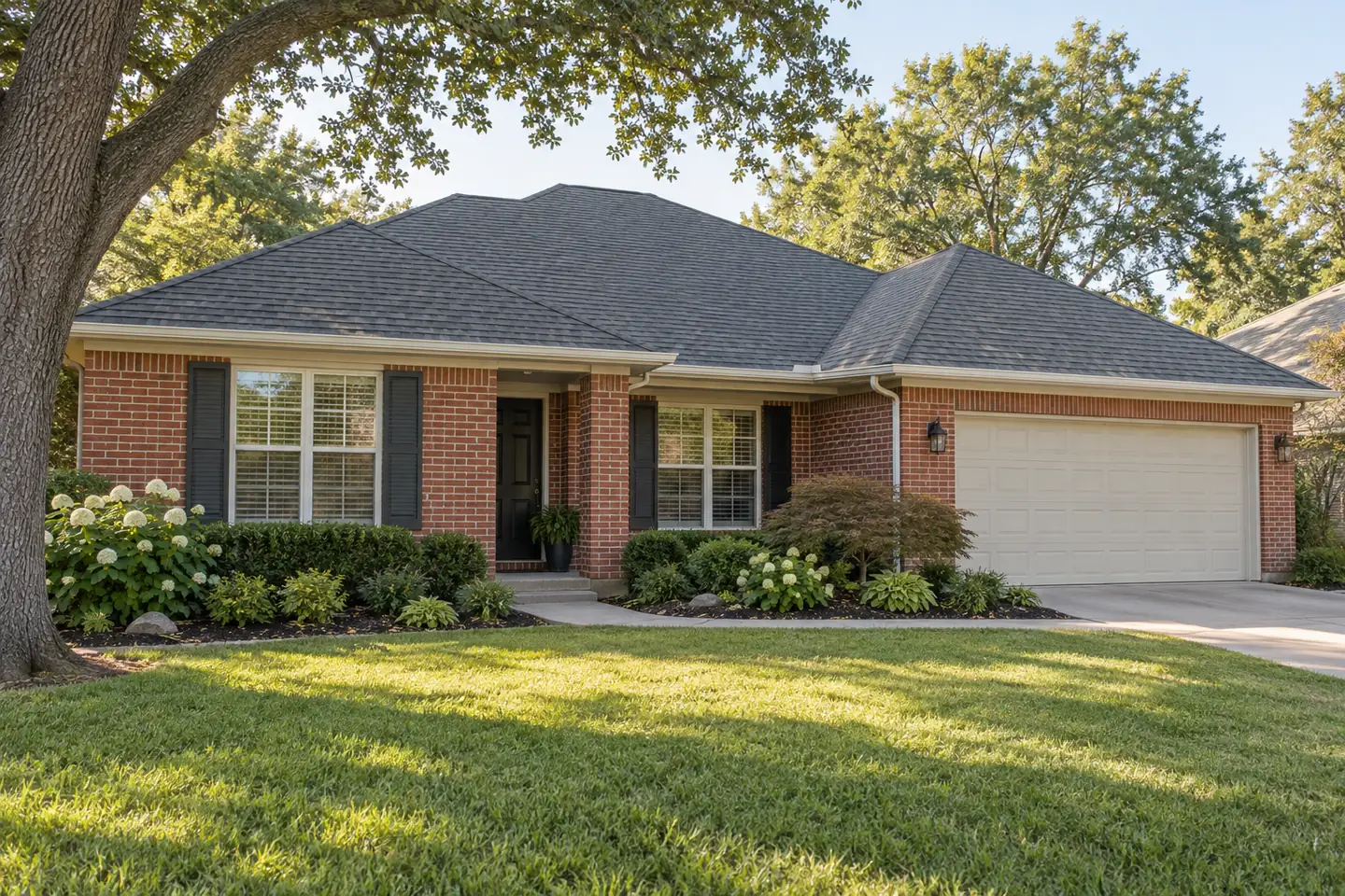 Red brick ranch home with a gray asphalt-shingle roof