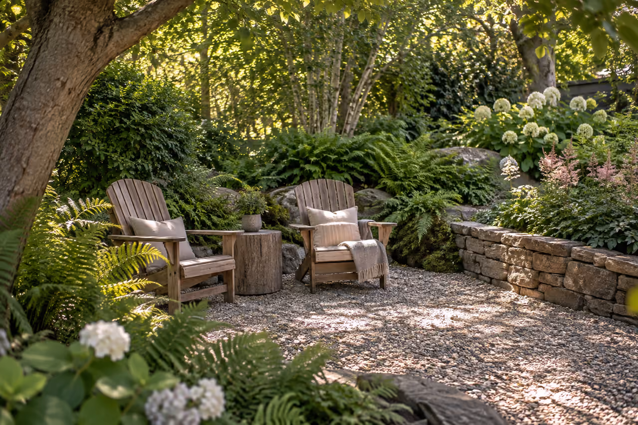 Timber lounge chairs in a secluded planted corner