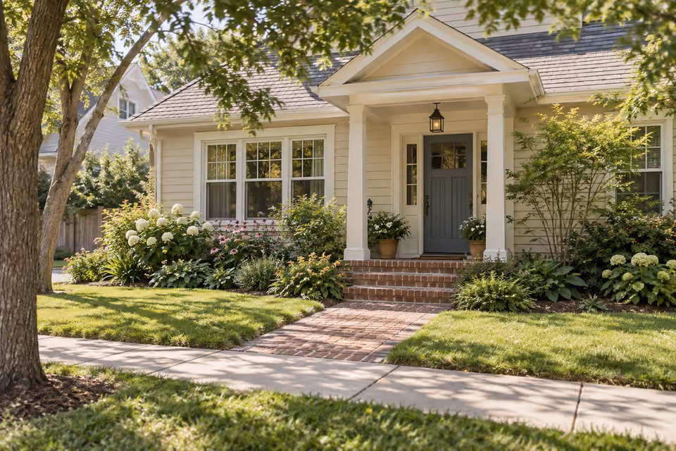 Comfortable home with a planted front garden and brick steps.